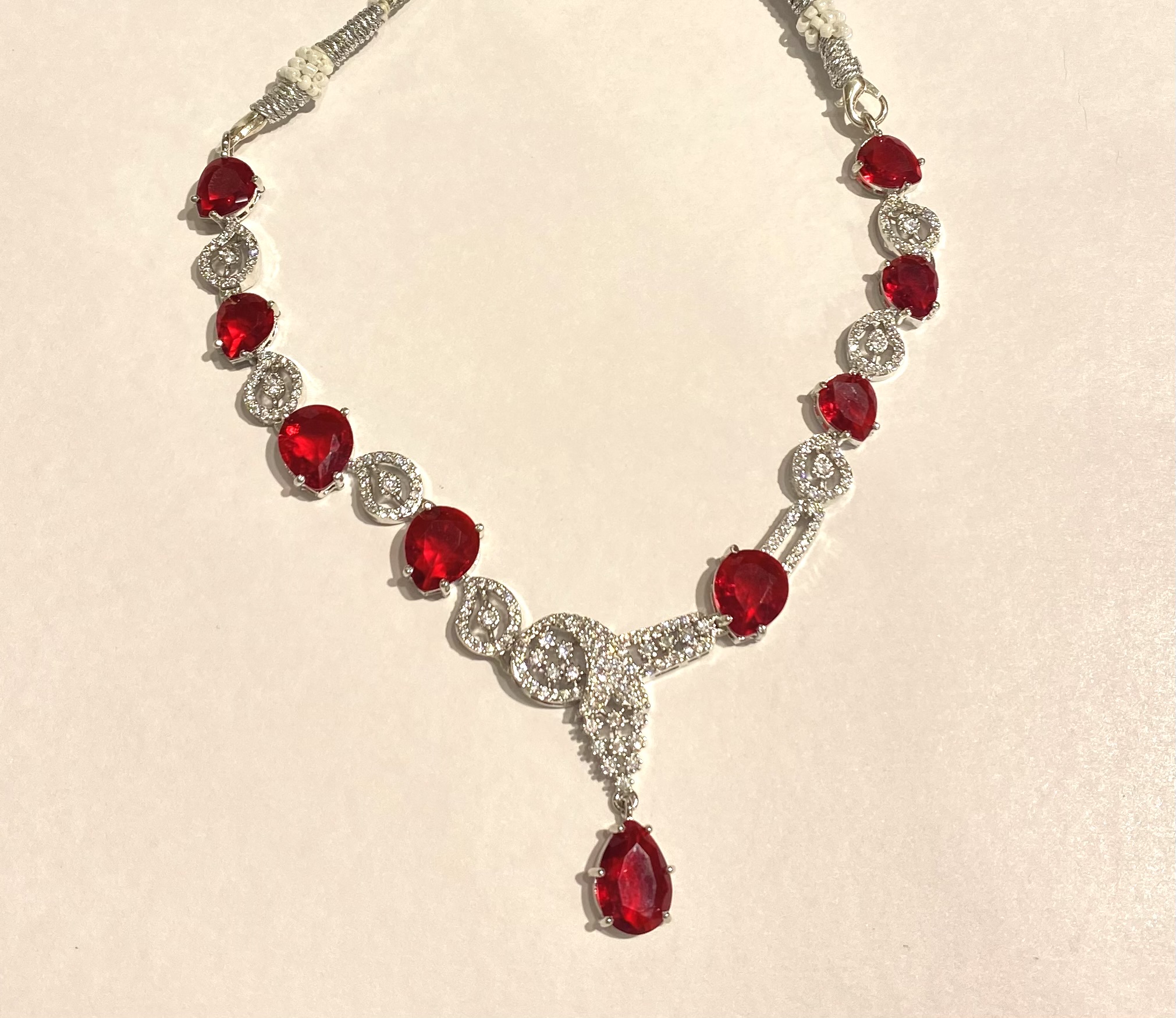 AD Necklace Set with Ruby & Silver Stones and Curved Earrings - Image 3