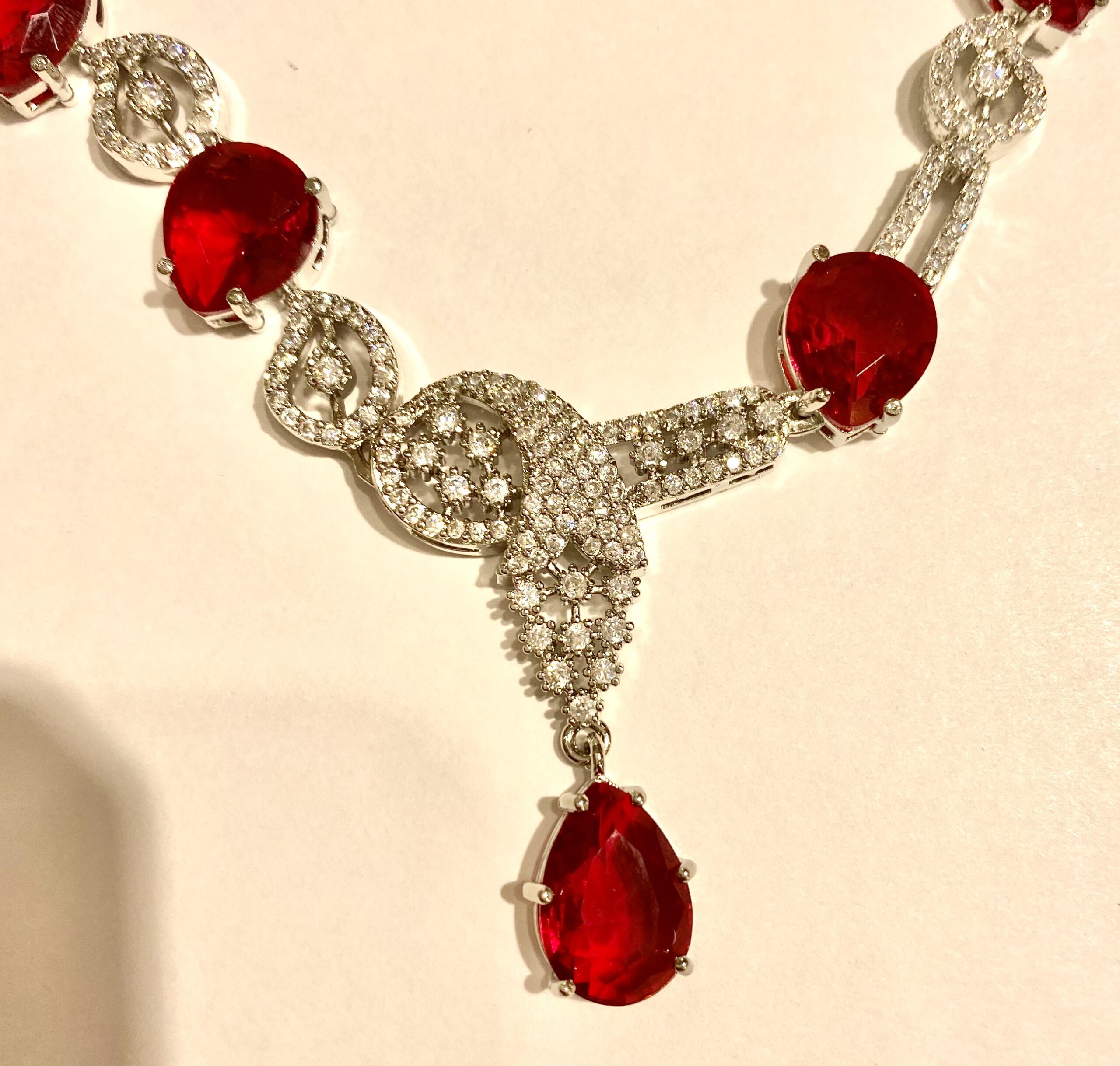 AD Necklace Set with Ruby & Silver Stones and Curved Earrings - Image 2